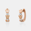 Boucles d'oreille huggies avec papillon et diamants