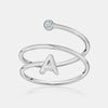 Bague spirale avec initiale et chaton en diamant